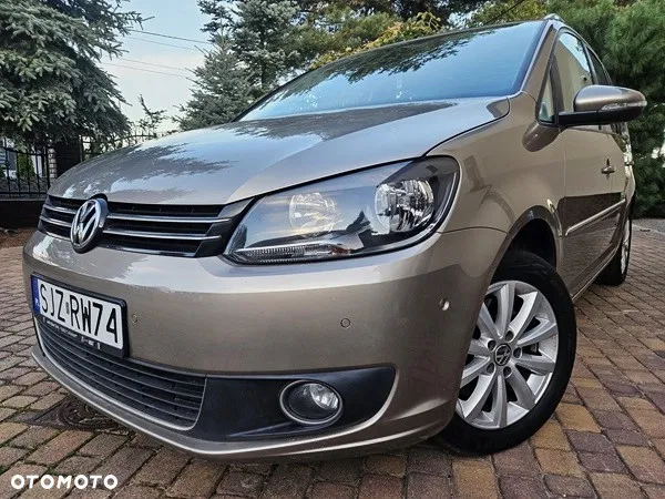 Volkswagen Touran — photo 1 of 26