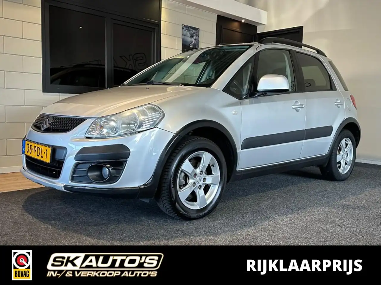 Suzuki SX4 1.6 EXCLUSIVE l NAP l STOELVERW l AUTOMAAT l CLIMA — photo 1 of 40