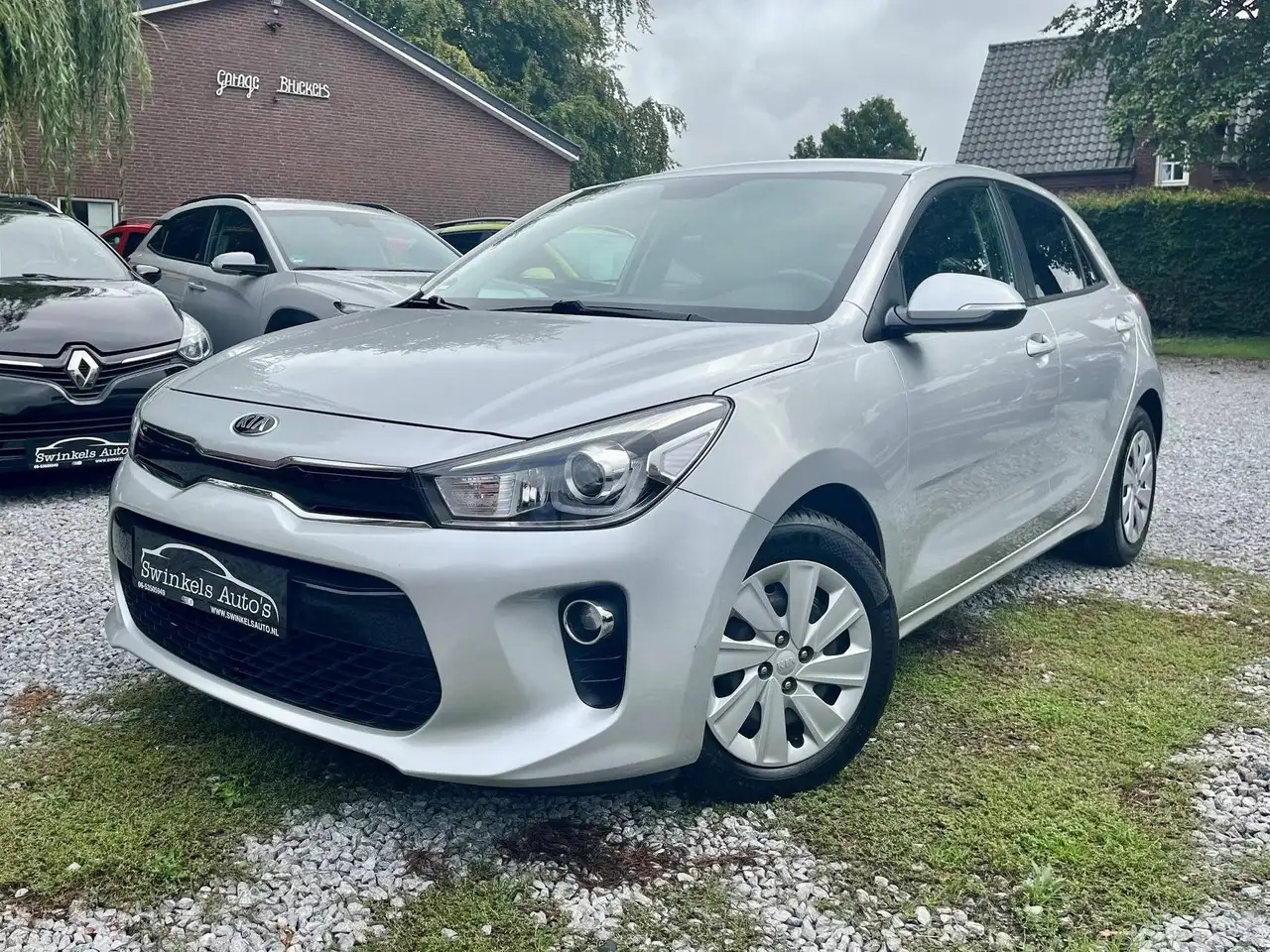 Kia Rio 1.2 CVVT-1e eigenaar-schadevrij-trekhaak-cruise contr-stoel- stuurverw.-armsteun-airco-4 seiz. banden-inklapb. spieg — photo 1 of 28