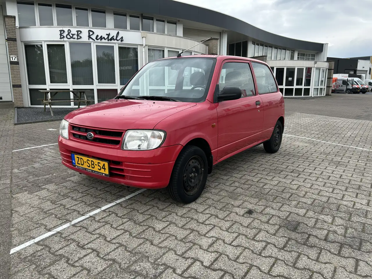 Daihatsu Cuore 1.0-12V XTi — photo 1 of 8