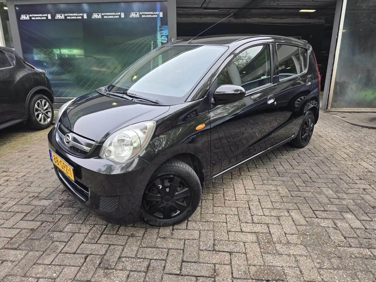 Daihatsu Cuore 1.0 Premium | 1E EIGENAAR |3/6 OF 12MND GARANTIE | — photo 1 of 32