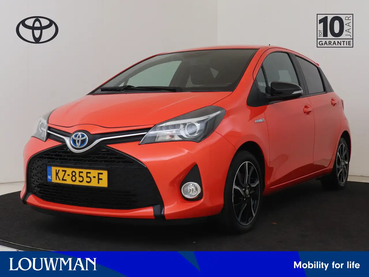 Toyota Yaris 1.5 Hybrid Orange Sport | Unieke uitvoering | — photo 1 of 40