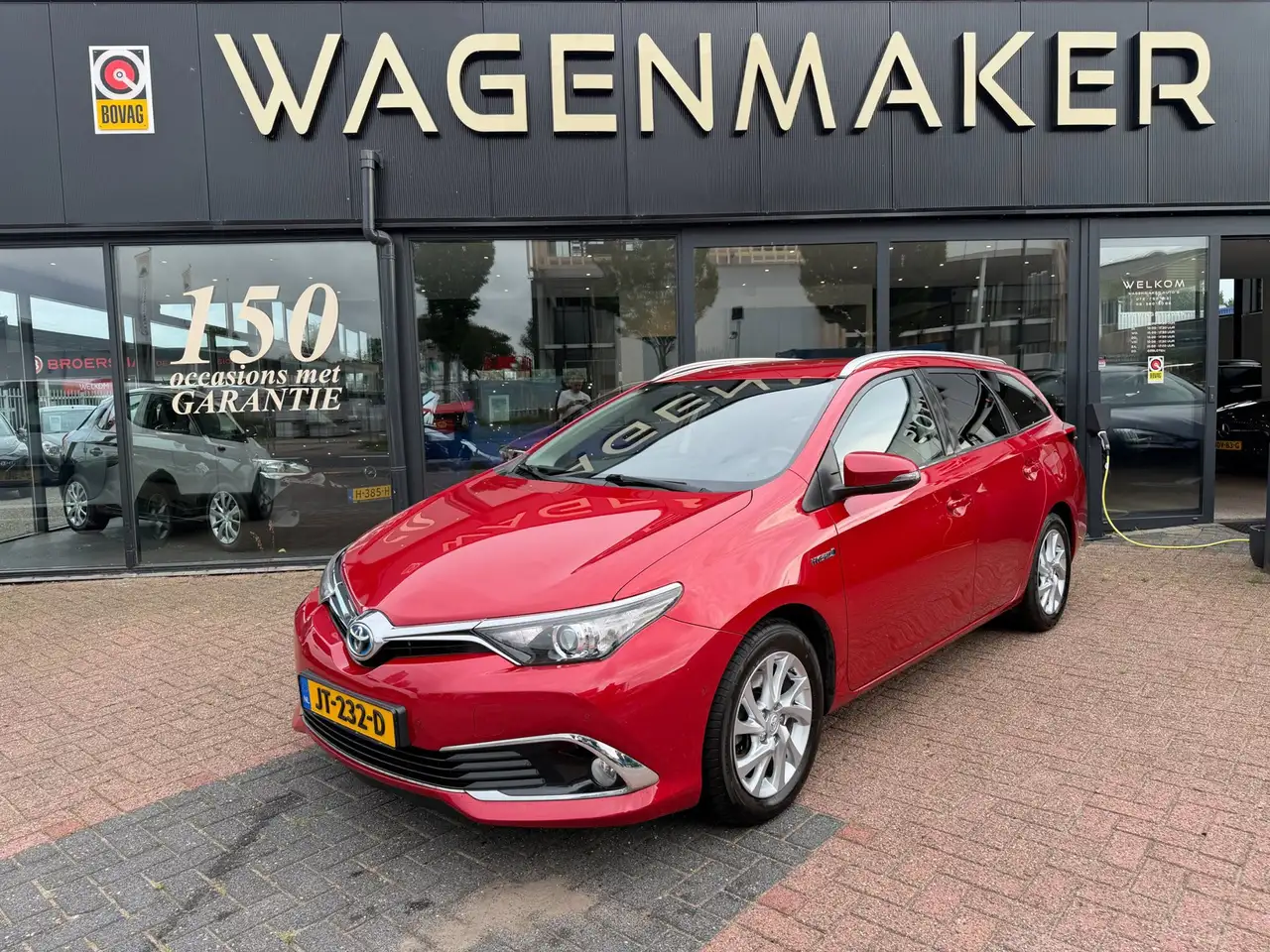 Toyota Auris Touring Sports 1.8 Hybrid Executive AUT|Carplay — photo 1 of 15