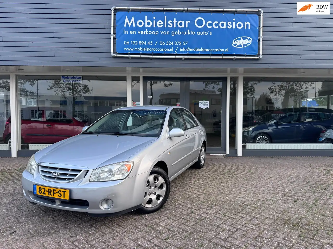 Kia Cerato 1.6-16V LX — photo 1 of 12