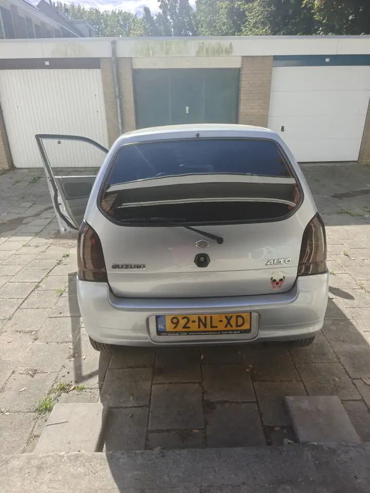 Suzuki Alto 1.1 GLS — photo 1 of 14