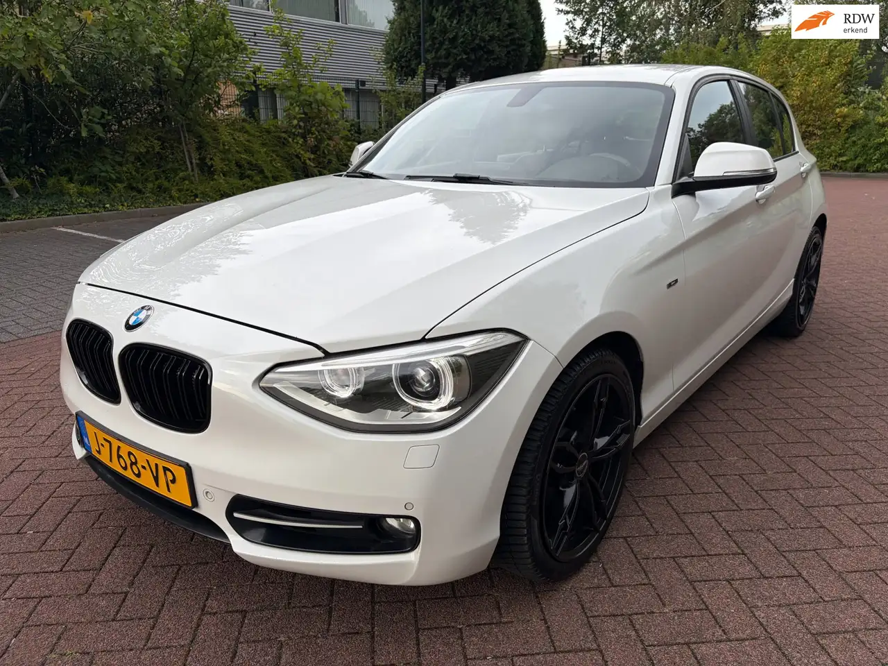 BMW 118 1-serie 118i High Executive / Automaat / Navi / Le — photo 1 of 17