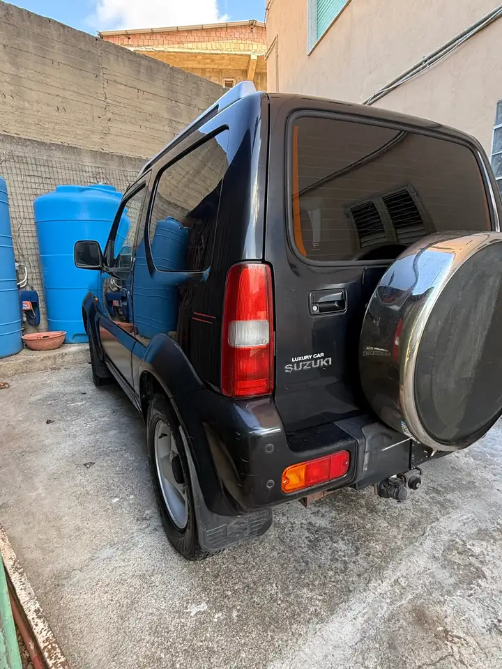 Suzuki Jimny Jimny 1.3 16v JLX c/abs,AC 4wd E3 — photo 1 of 13