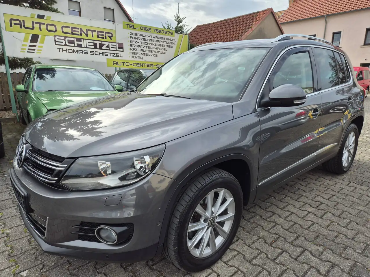 Volkswagen Tiguan Sport *2.Hand*gepflegtes Fzg*guteKm*Scheckheft* — photo 1 of 17