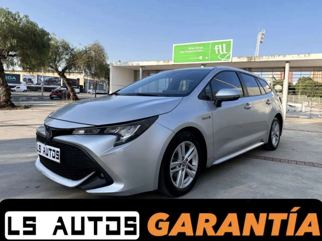 Toyota Corolla Touring Sports 125H Business Plus — photo 1 of 39