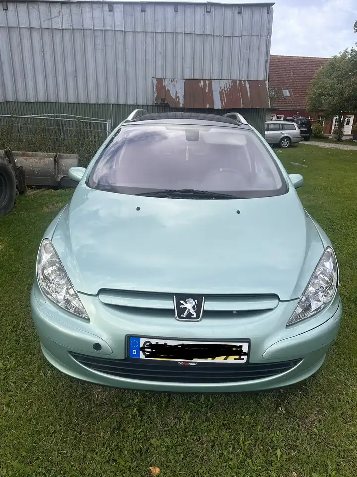 Peugeot 307 — photo 1 of 15