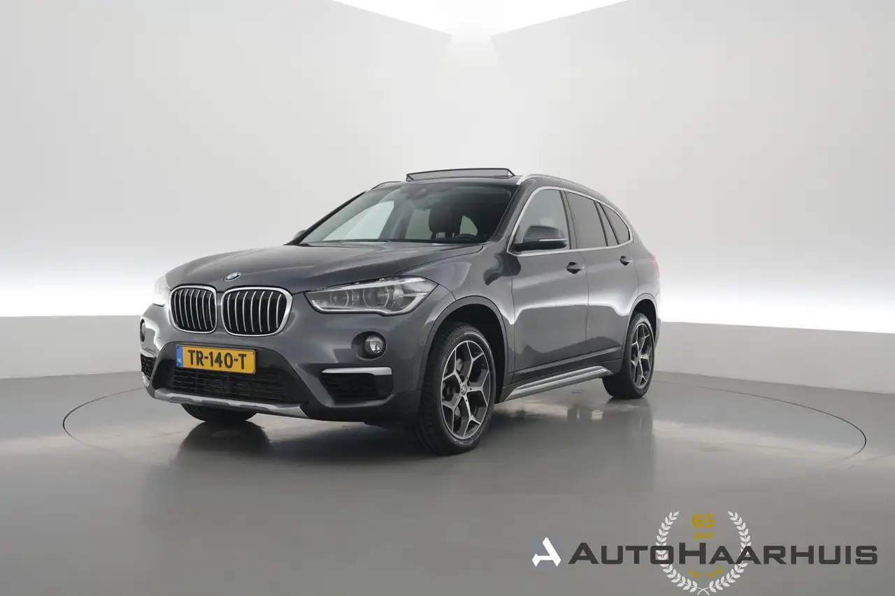 BMW X1 sDrive20i Orange Edition II | Rijklaar! | Navi | C — photo 1 of 35